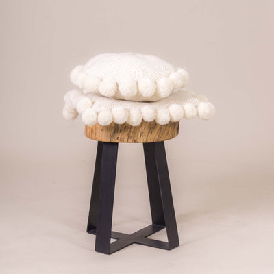Sheep wool cushion with pompoms